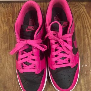 Nike Pink and Black Athletic Shoes with Bold Design